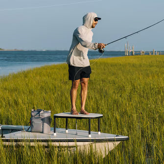 Fisherman casting from a boat