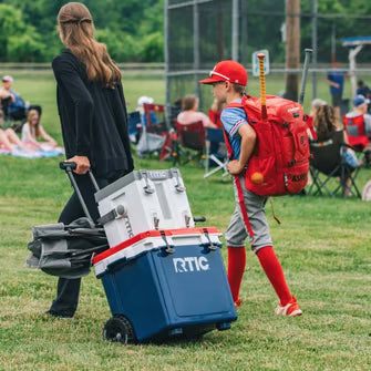 Family taking a cooler to the field