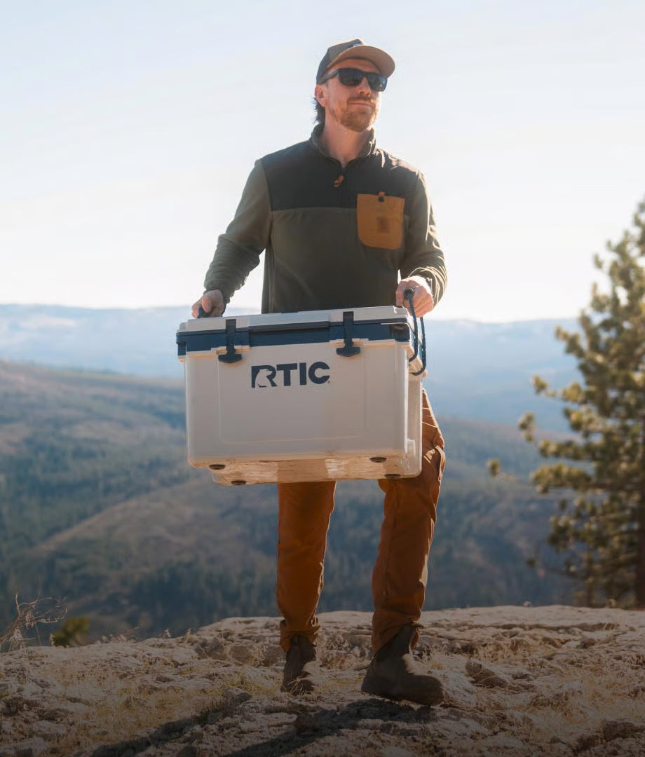 Hiker carrying a hard cooler